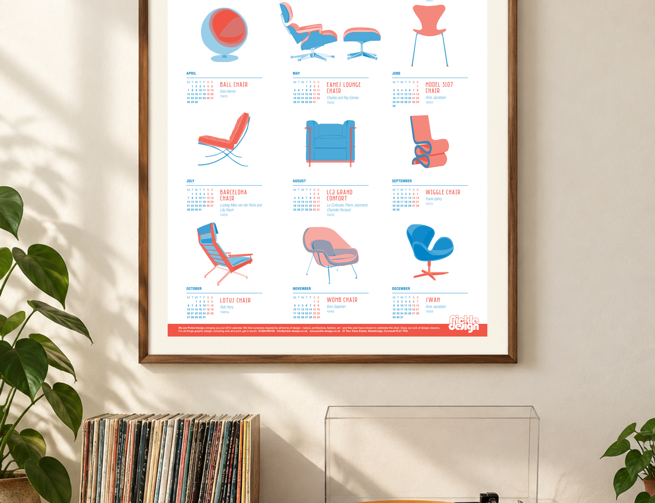 2014 Pickle Design calendar featuring illustrated classic chairs, framed above a record player