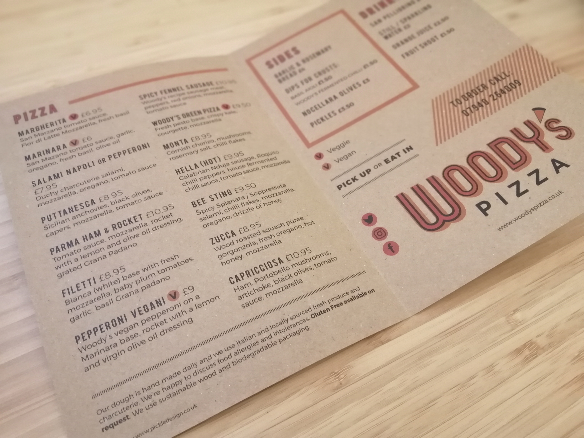 Woody's Pizza menu printed on brown paper