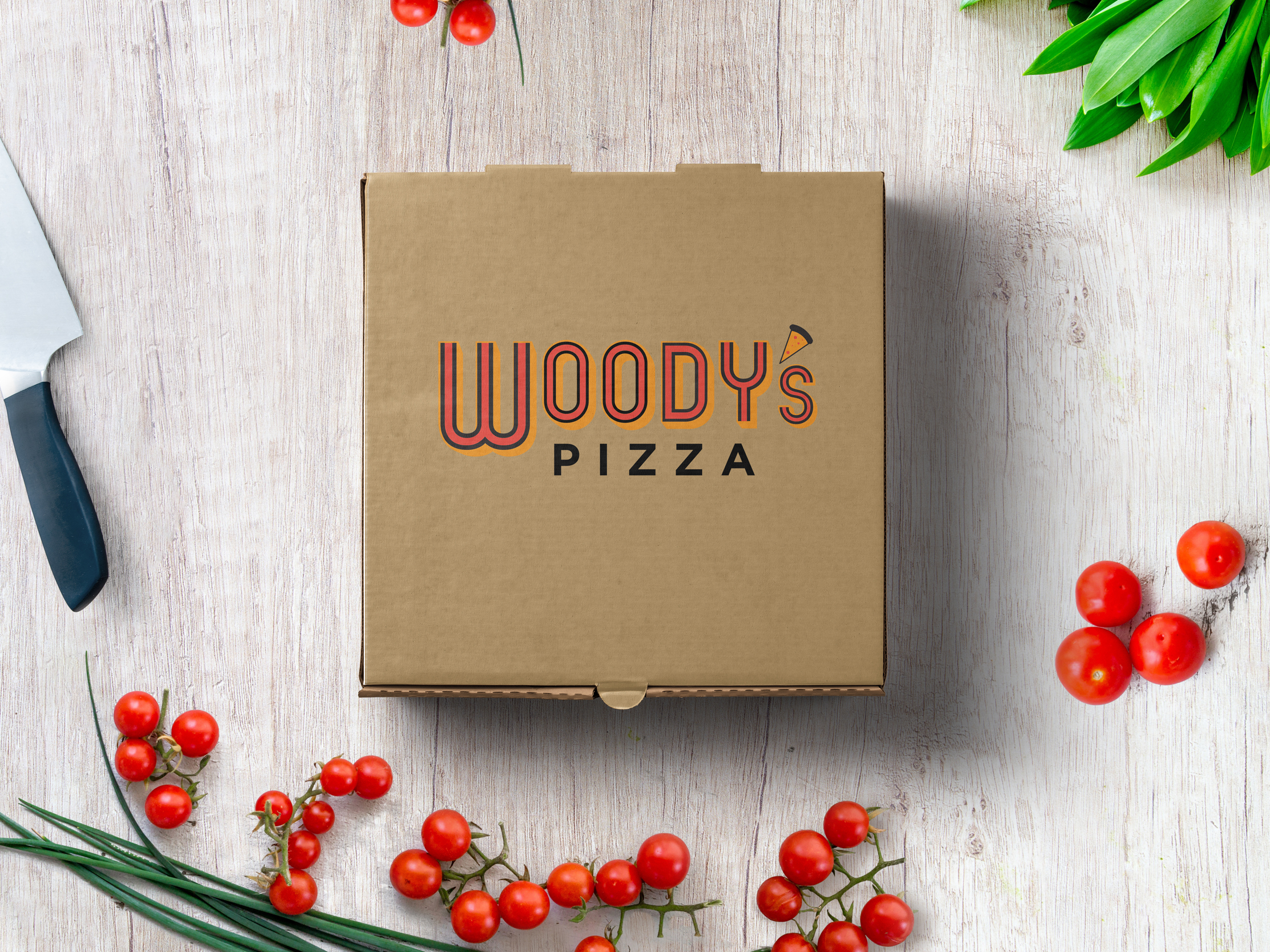 Woody's Pizza logo on a brown pizza box
