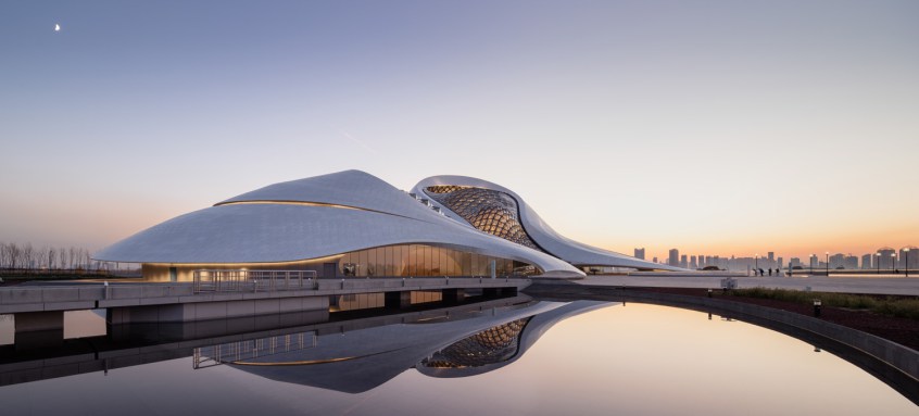 Exterior photograph of Harbin Opera house at dusk