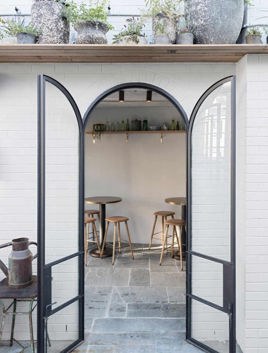 Arched doorway with white tiles 