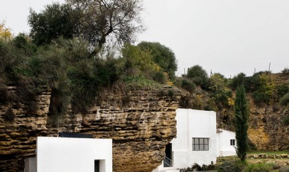 Cave house in spain with white modern cube additions