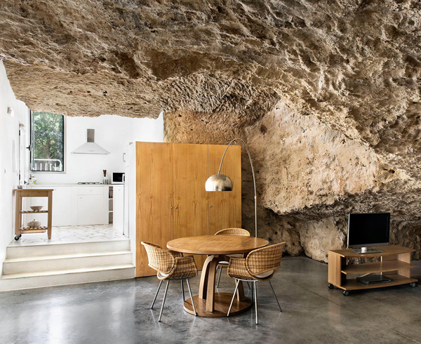 Rough rock walls and modern furniture 