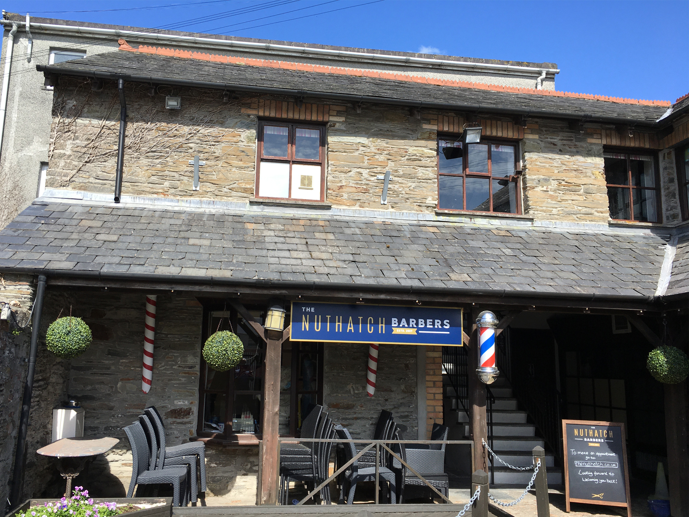 The Nut Hatch Barbers signs