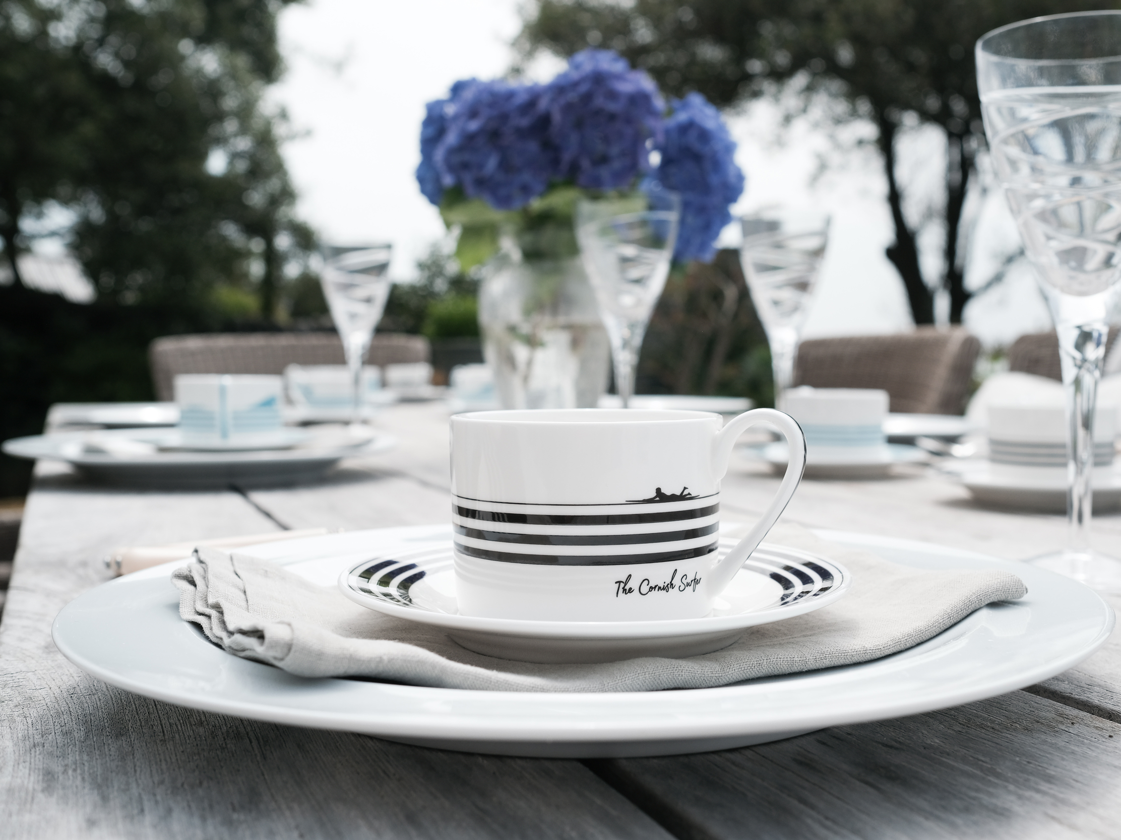 The Cornish Surfer branded crockery photographed in a styled interior setting