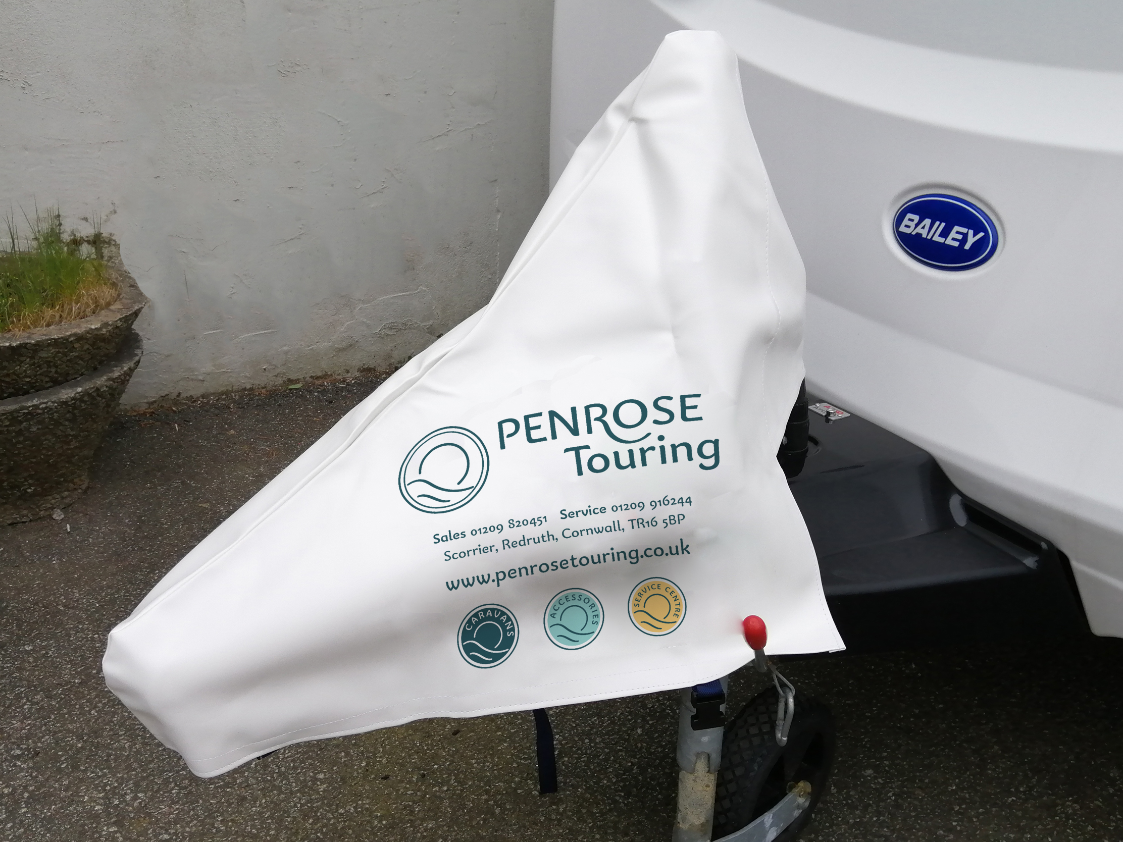 Branded caravan hitch cover designed for Penrose Touring