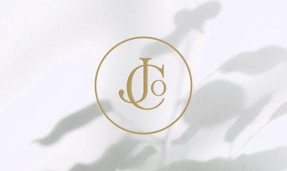 Jo and Co Home logo emblem presented on blush pink and dark blue backgrounds