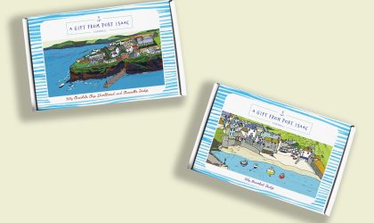 Two Harbour Treats confectionery gift boxes featuring colourful illustrations of Port Isaac village and harbour