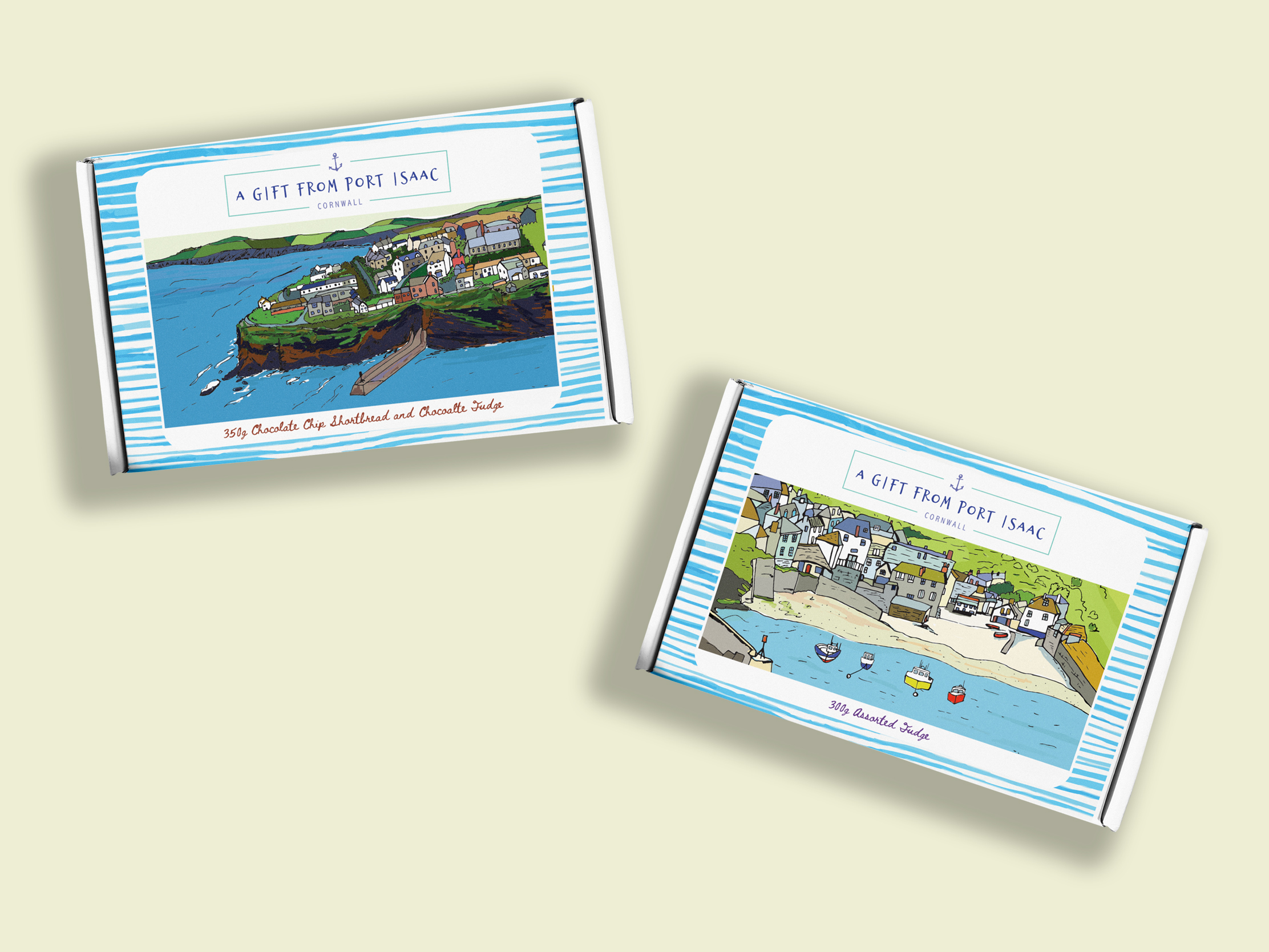 Two Harbour Treats confectionery gift boxes featuring colourful illustrations of Port Isaac village and harbour