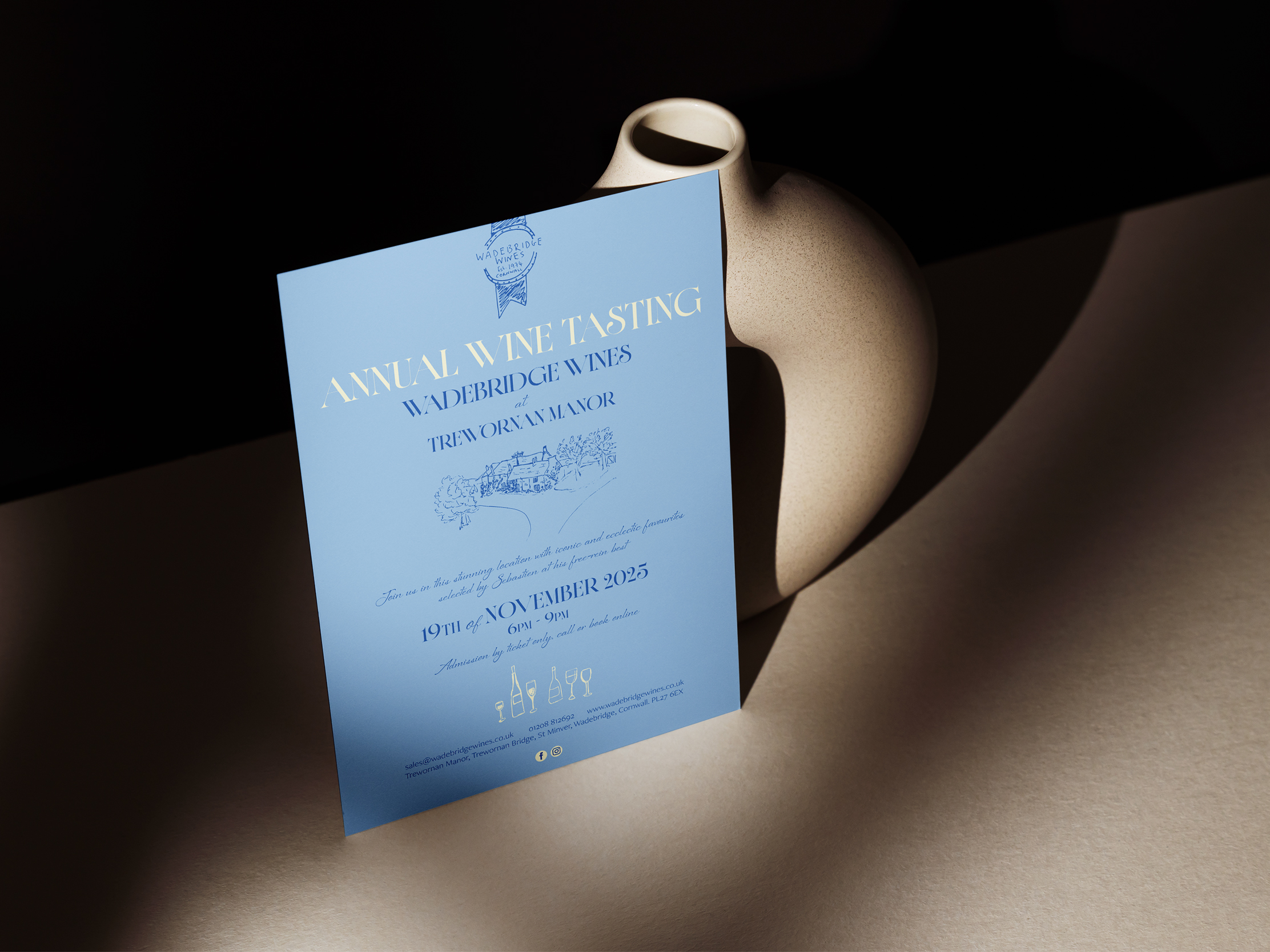 A photo showing the printed invitation and ticket for the Wadebridge Wines 2025 tasting, designed in powder blue and navy.