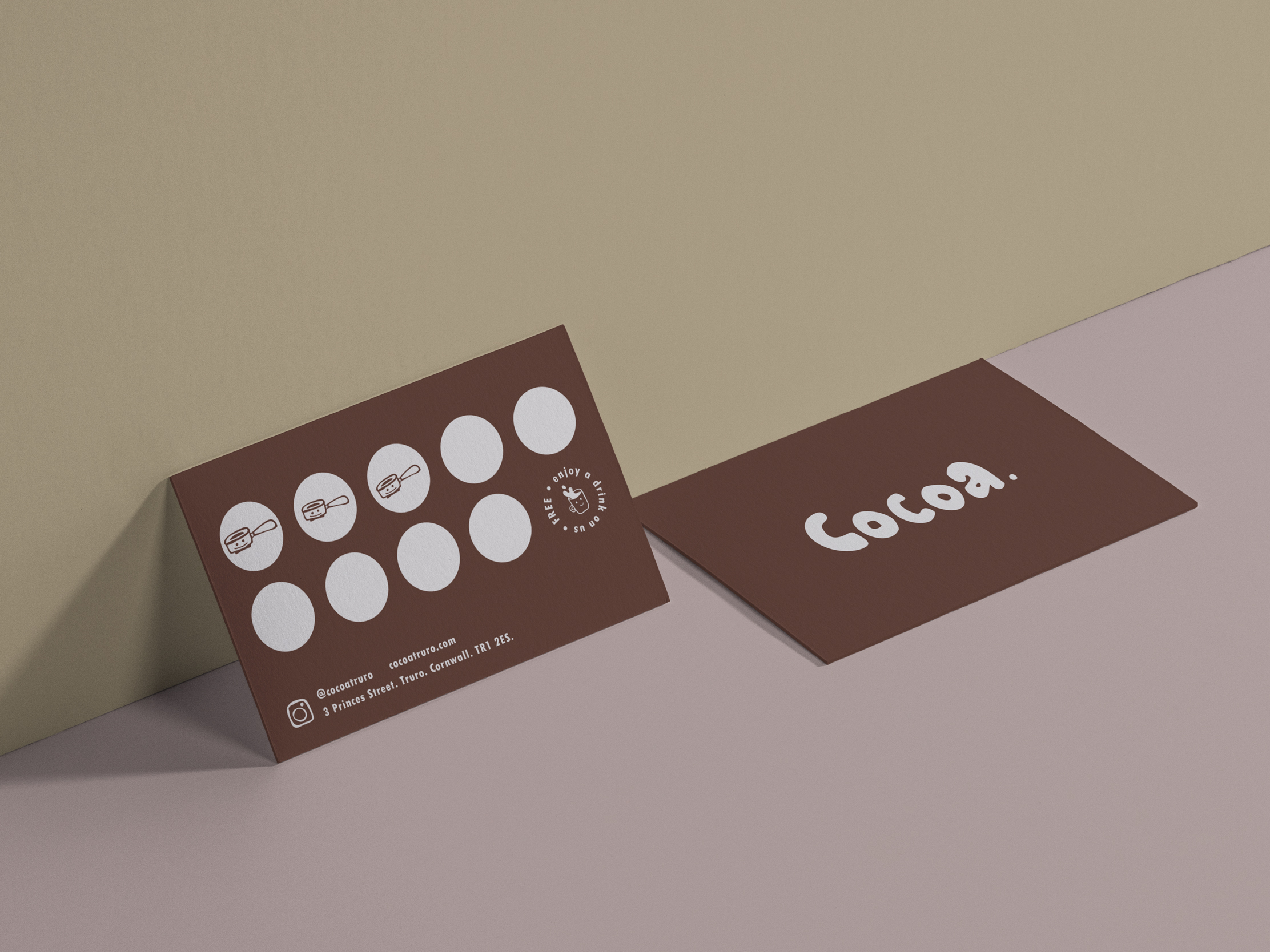 Cocoa loyalty card design showing printed cards with stamp spaces and logo